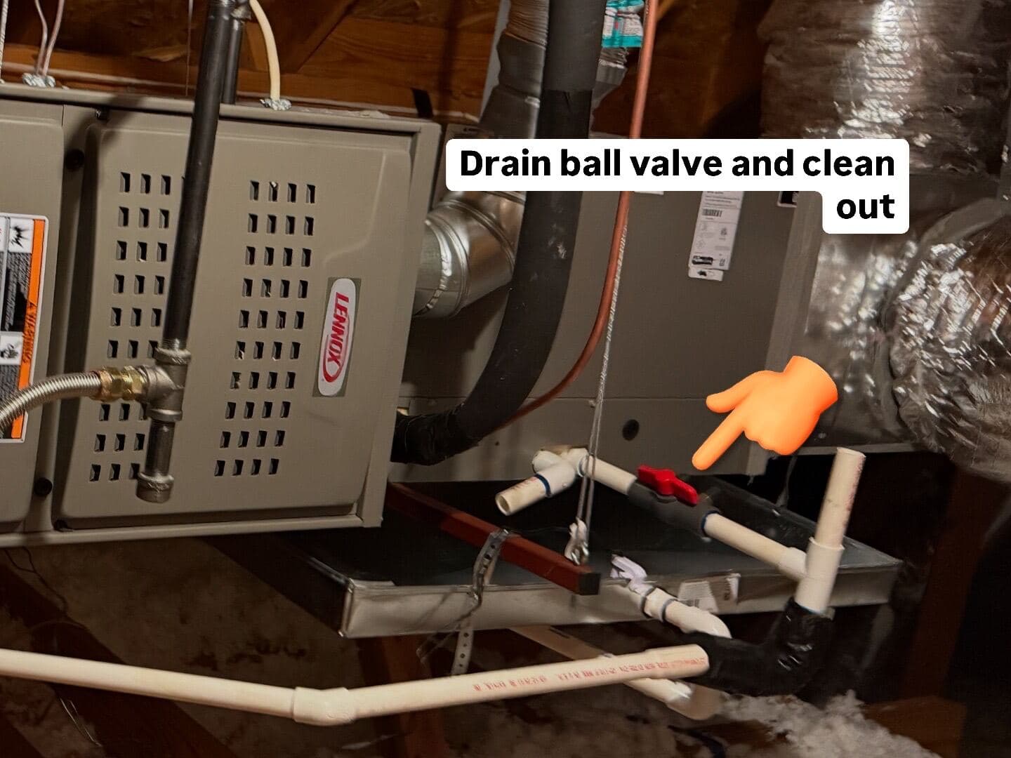 Condensate drain ball valve and clean-out pointed out during a Strike Force tune-up