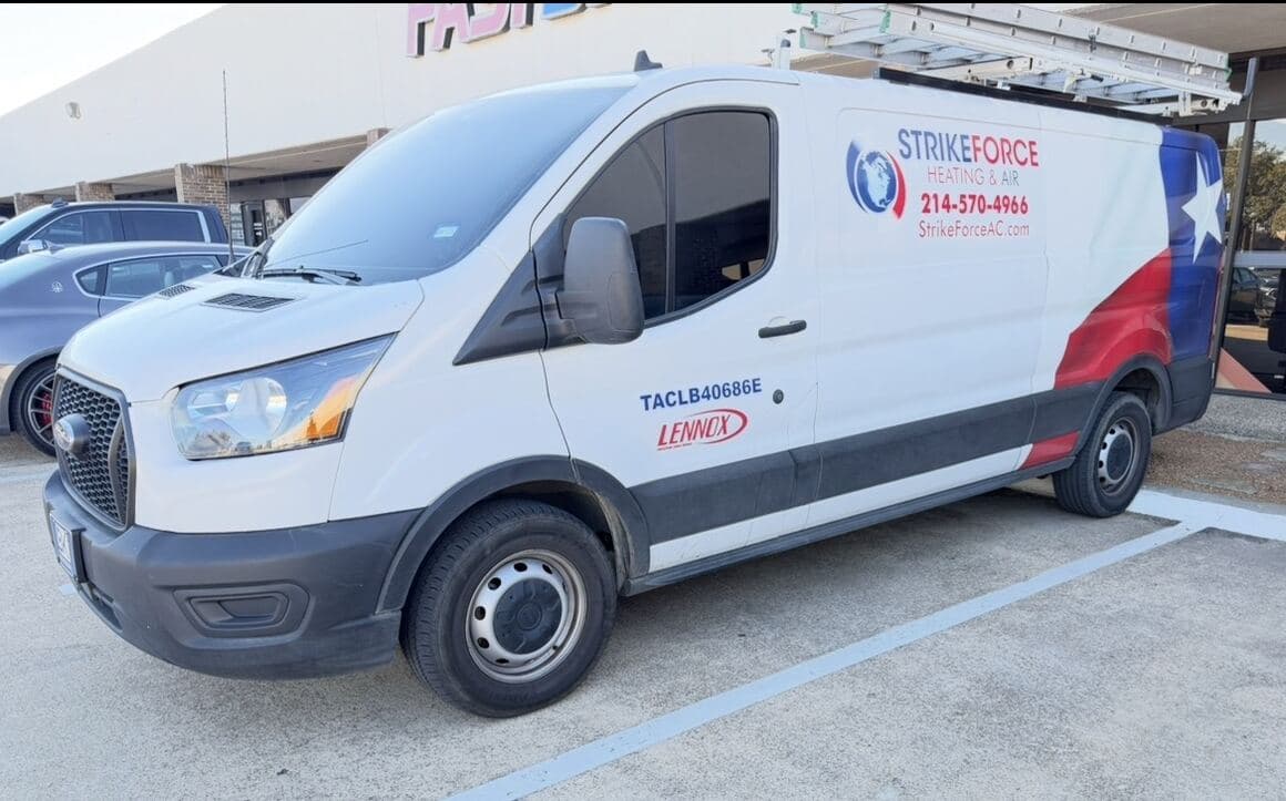 Strike Force Heating & Air service van parked at a Dallas commercial property